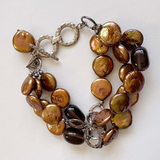 silpada Bracelet with gold pearls and quartz beads on a white background