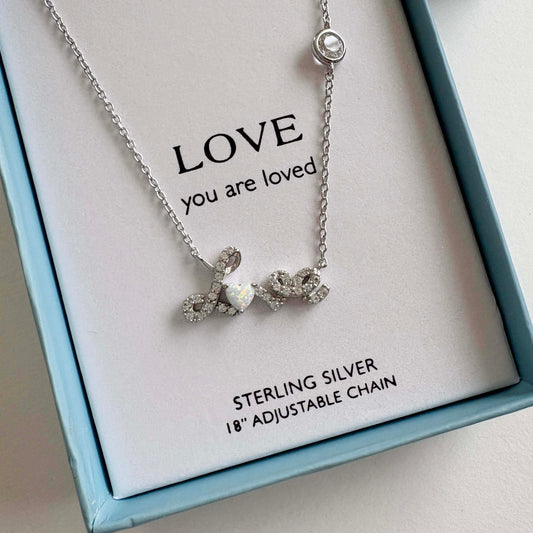 Silver Love necklace with 'LOVE you are loved' message on a card