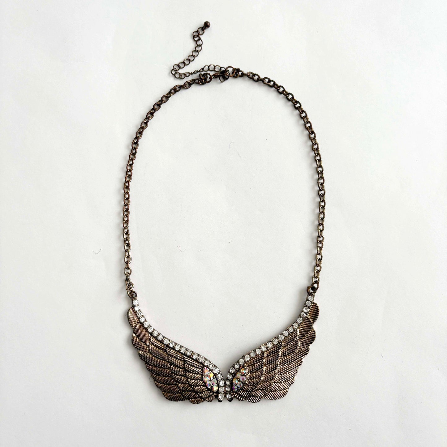 Necklace with wing-shaped pendant on a white background